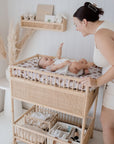Baby being changed by parent on the Co Sleeper Bear in There Change Mat