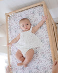 Baby lying on the Co Sleeper Botanical Change Mat