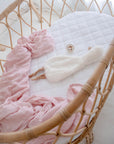 Small Oval/Moses Fitted Waterproof Sheet in Ivory With Toy and Pink Muslin Blanket