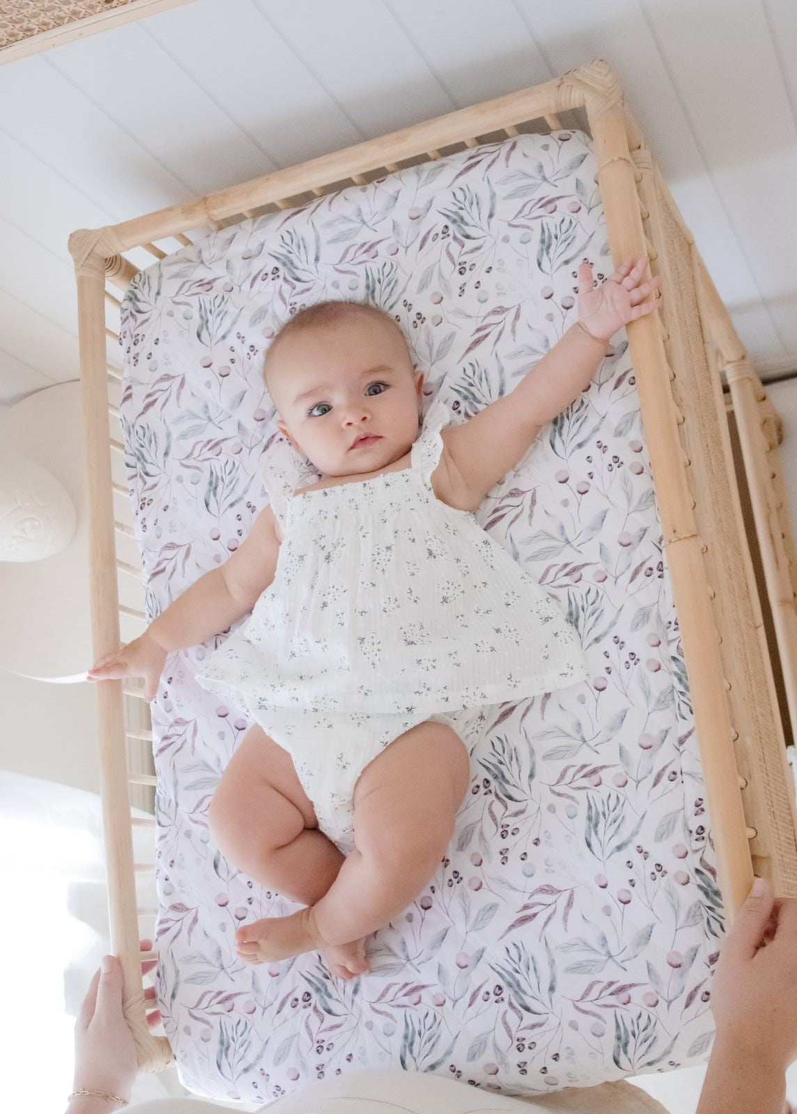 Baby lying on the Co Sleeper Botanical Change Mat 